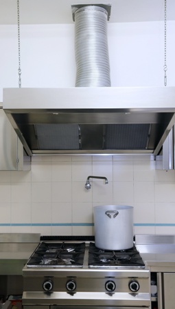 Do stovetop exhaust fans help in cooling a room? 